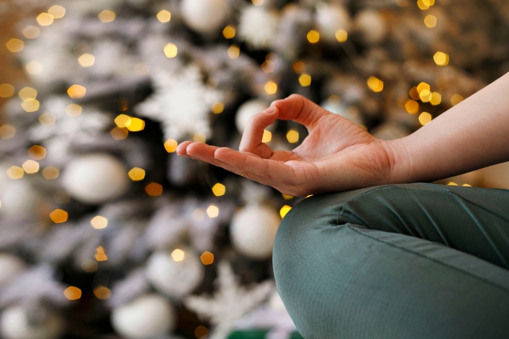 Close-up,Of,Woman’s,Hand,During,Meditation,Sitting,Over,New,Year